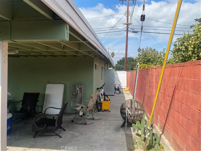 a view of a room with furniture and a window