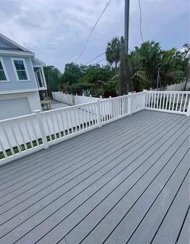 a view of a balcony with wooden floor