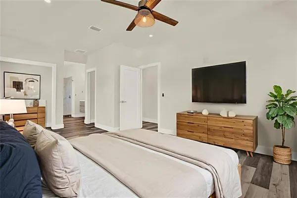 a view of an empty room with wooden floor