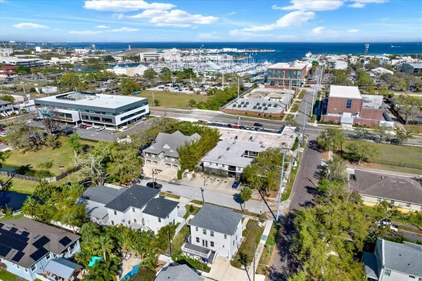 an aerial view of residential houses with outdoor space
