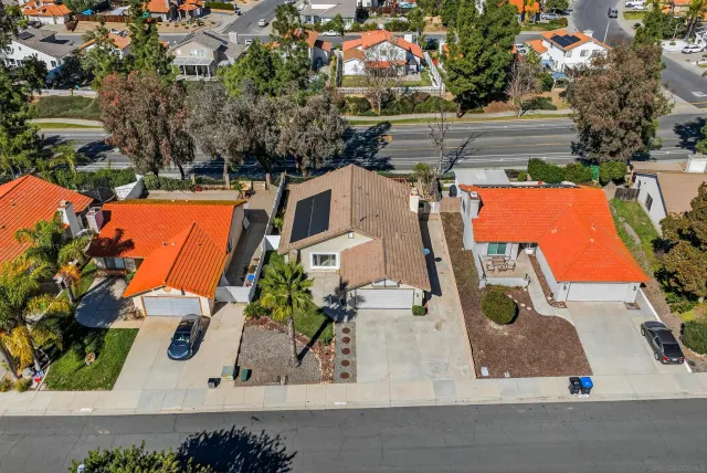 an aerial view of residential houses with outdoor space