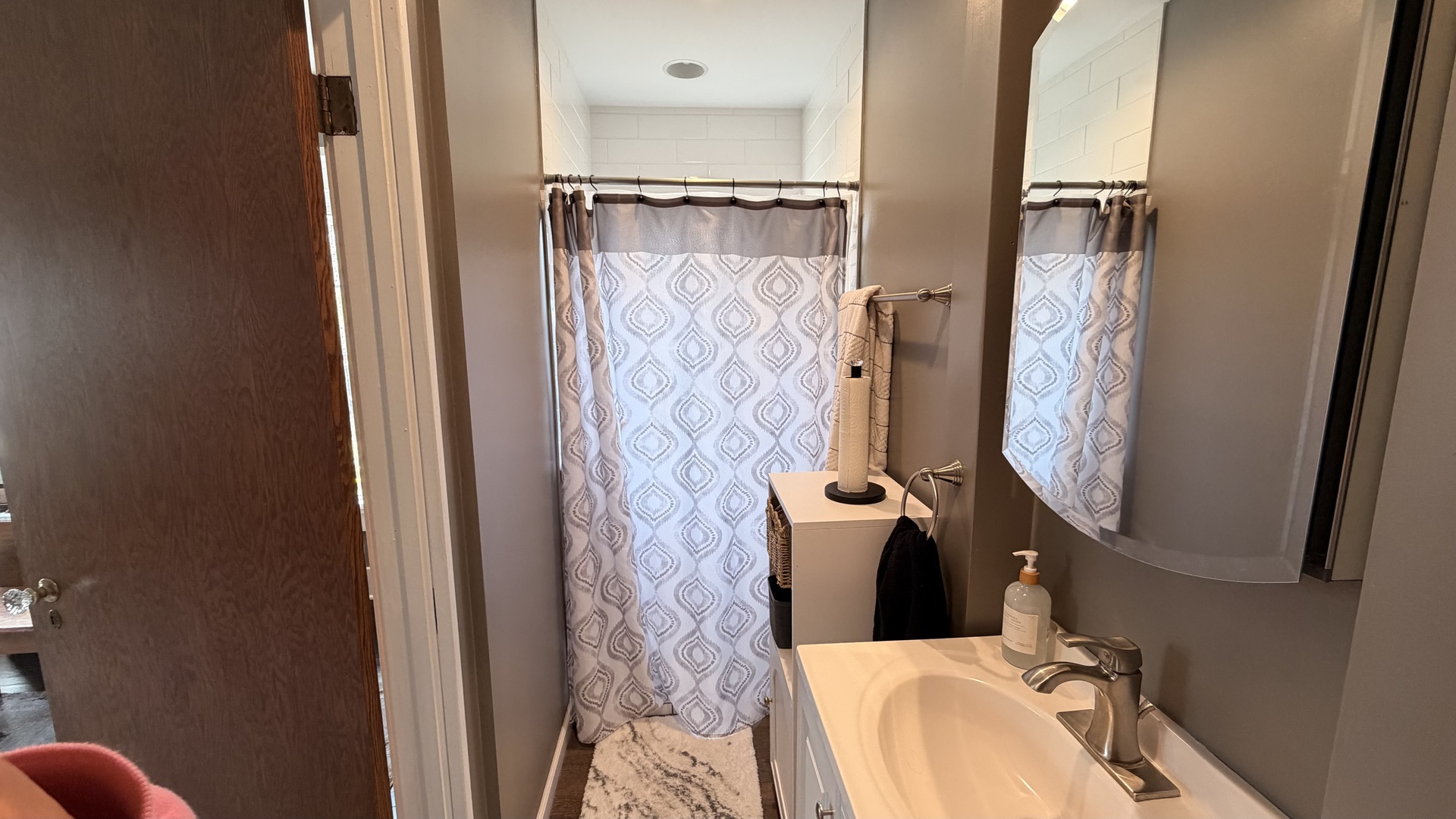 909 East 3rd Street Centralia, IL 62801 - Photo 16 of 25 walk in closet with wooden floor and shower