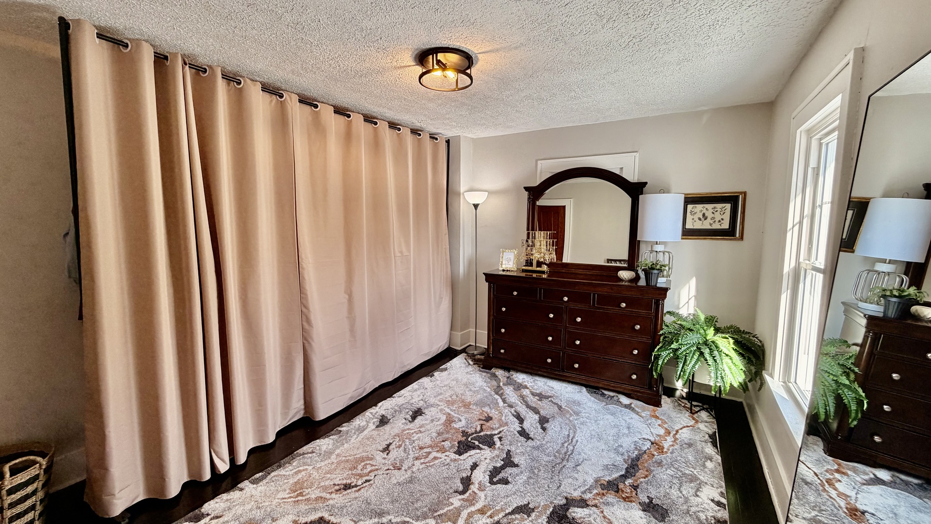 909 East 3rd Street Centralia, IL 62801 - Photo 23 of 25 a bedroom with a bed and a dresser in it