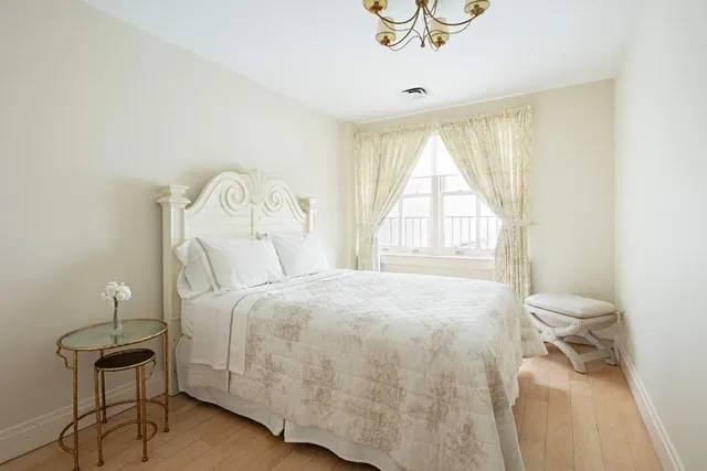 a view of living room with a chandelier and living room view