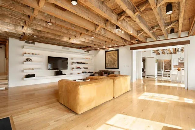 a bathroom with a sink double vanity granite tub shower and a mirror