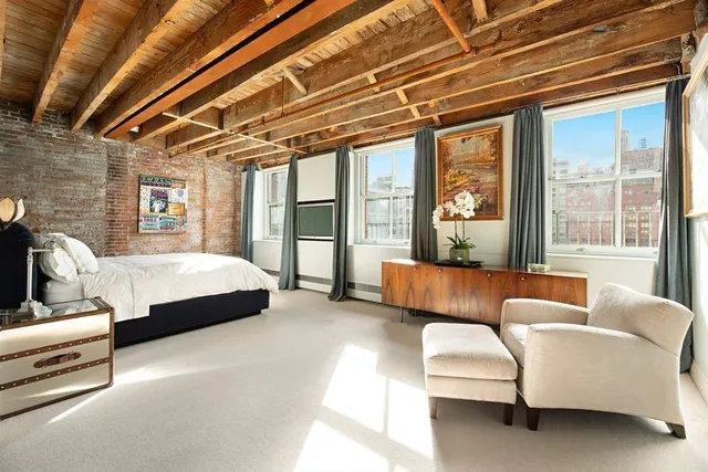 a bed room with a bed and a lamp