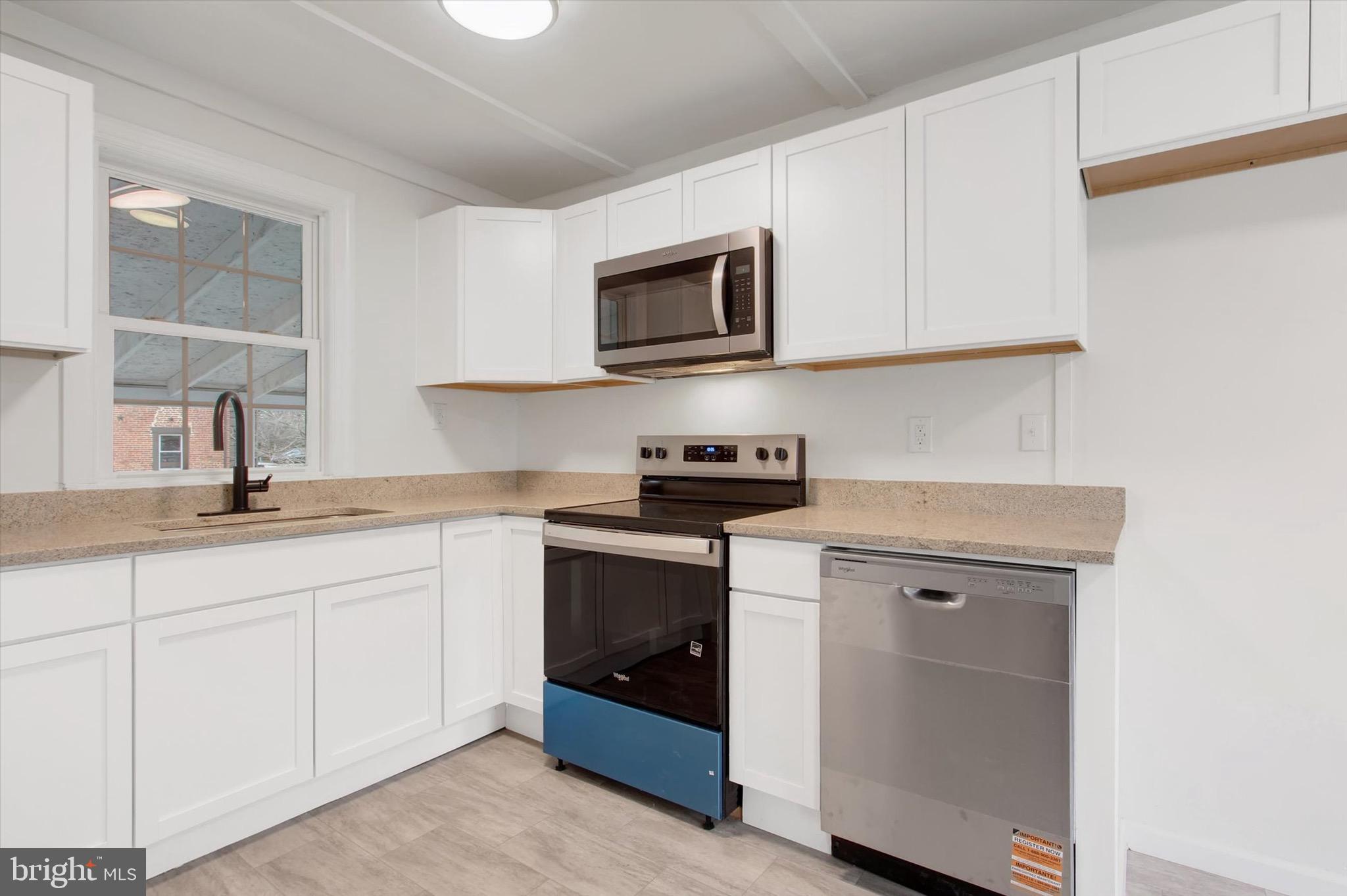 2515 Mummasburg Road Gettysburg, PA 17325 - Photo 13 of 22 a kitchen with white cabinets and sink
