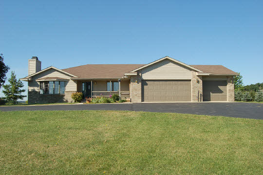 1771 East Town Line Road Oregon, IL 61061 - Photo 1 of 6 a front view of a house with garden