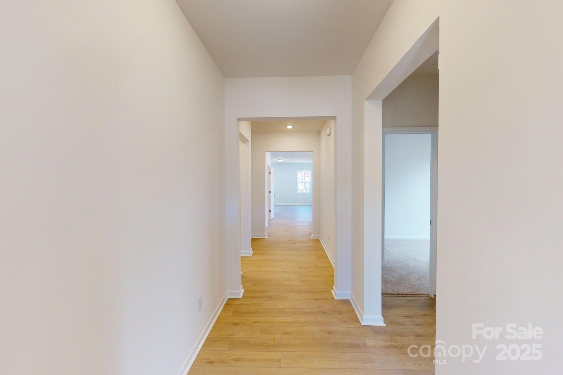 1494 Kate Cecil Way York, SC 29745 - Photo 3 of 20 a view of a hallway with wooden floor