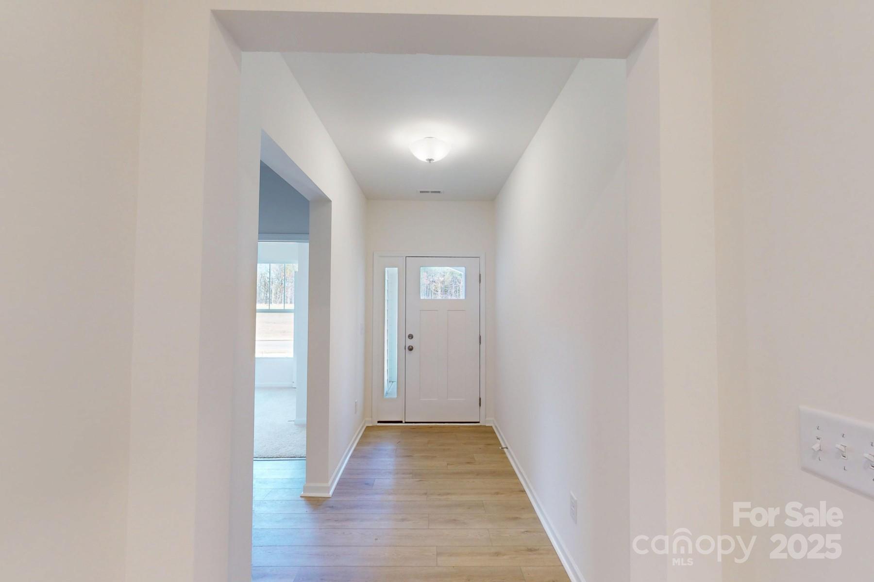 1494 Kate Cecil Way York, SC 29745 - Photo 4 of 20 a view of a hallway with wooden floor