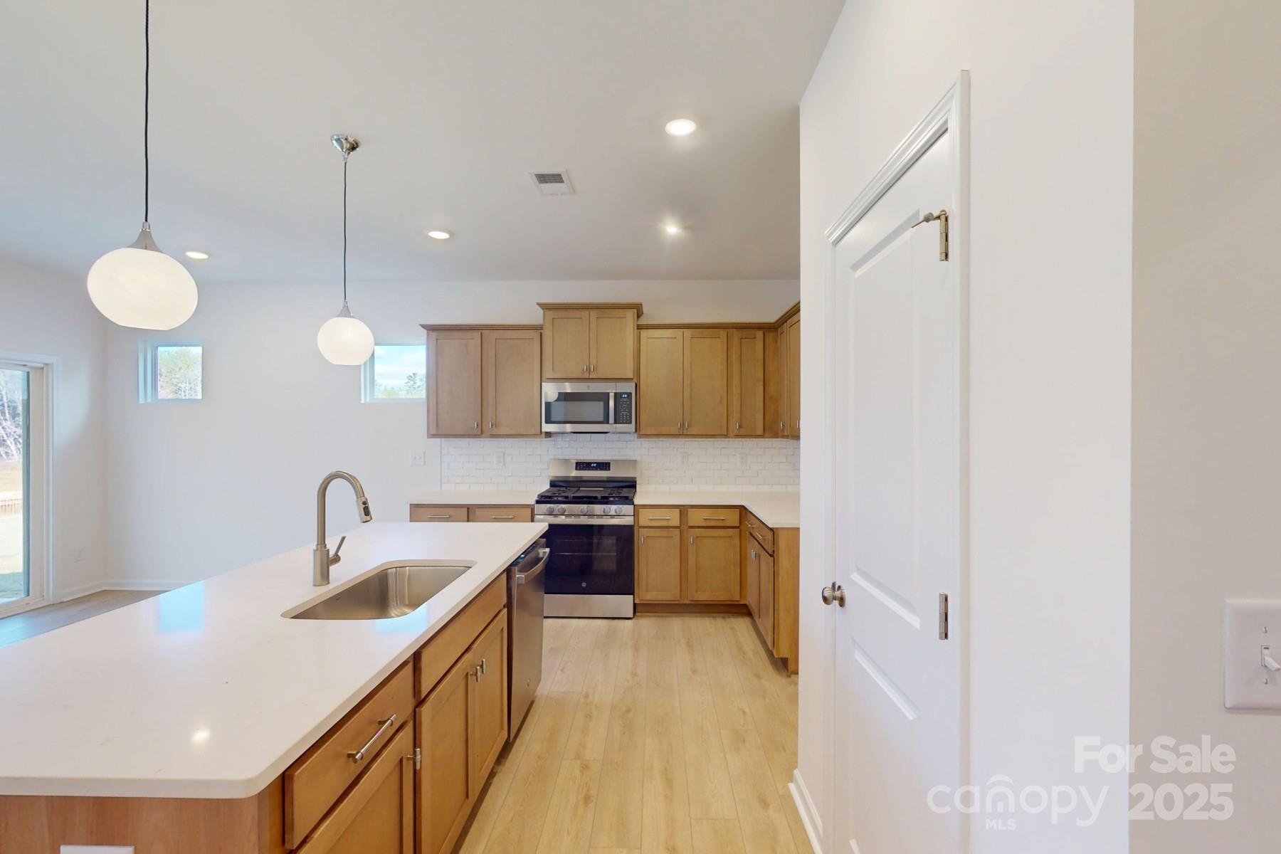 1494 Kate Cecil Way York, SC 29745 - Photo 6 of 20 a kitchen with counter top space sink stove and refrigerator