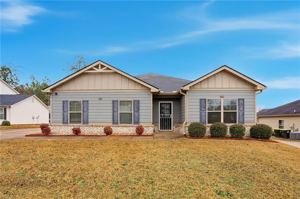a front view of a house with a yard