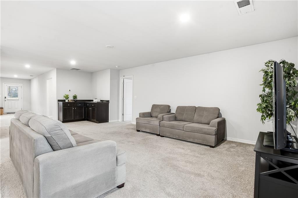 6968 New Dale Road Rex, GA 30273 - Photo 11 of 47 a living room with furniture and a flat screen tv