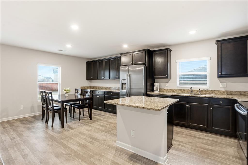 6968 New Dale Road Rex, GA 30273 - Photo 13 of 47 a kitchen with cabinets and sink