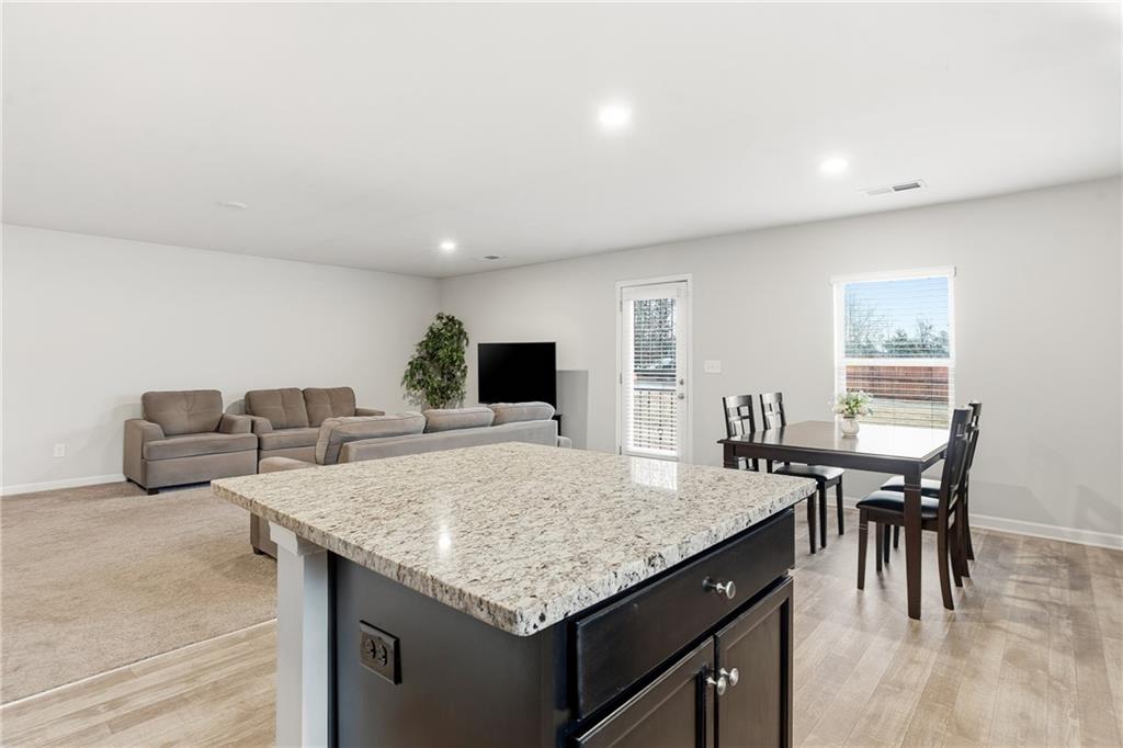 6968 New Dale Road Rex, GA 30273 - Photo 14 of 47 a living room with furniture and a table