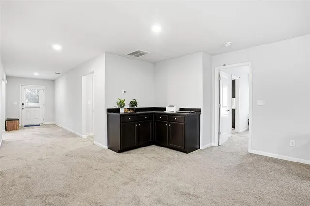a bedroom with a bed and a potted plant