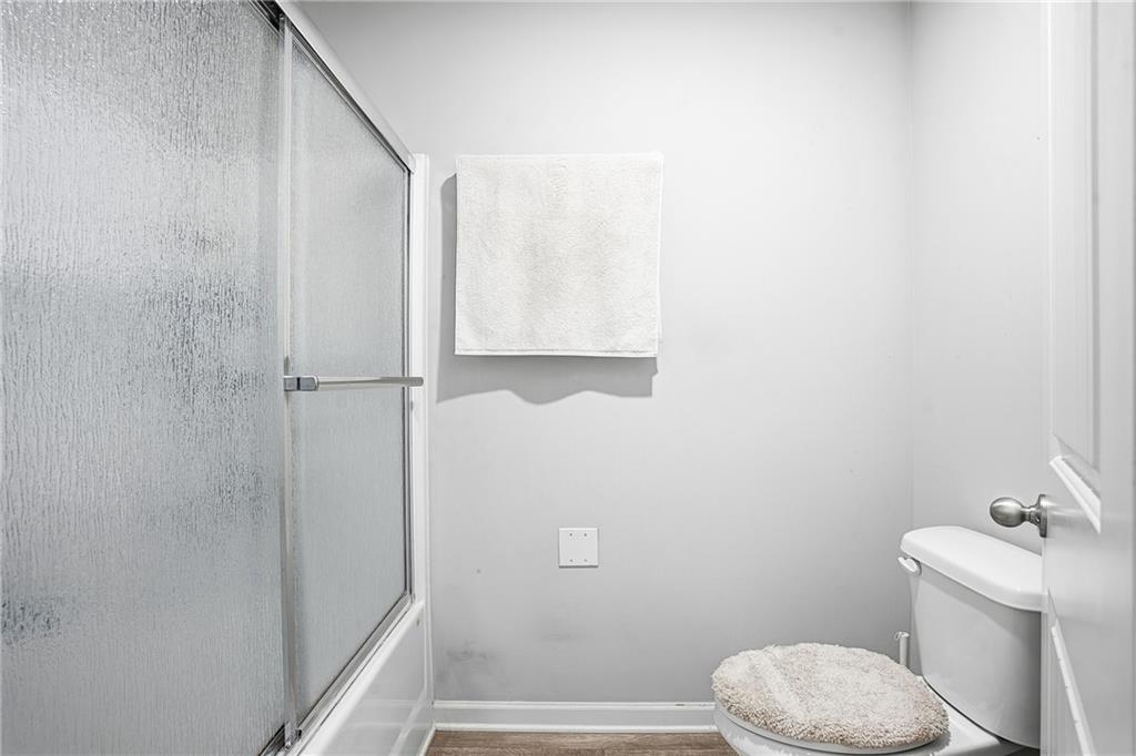 6968 New Dale Road Rex, GA 30273 - Photo 26 of 47 a bathroom with a toilet and a shower