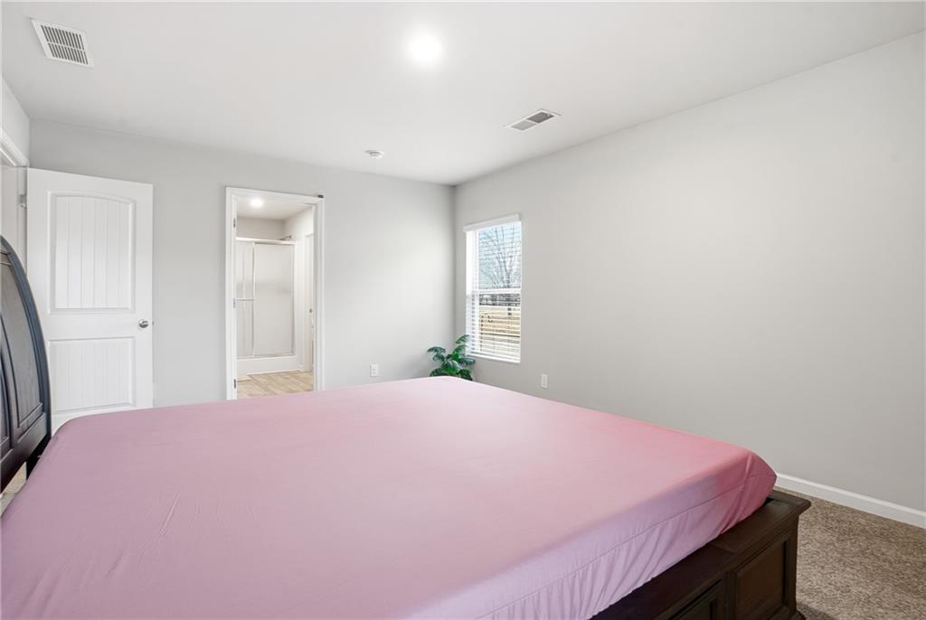 6968 New Dale Road Rex, GA 30273 - Photo 35 of 47 a bed room with a bed and a window