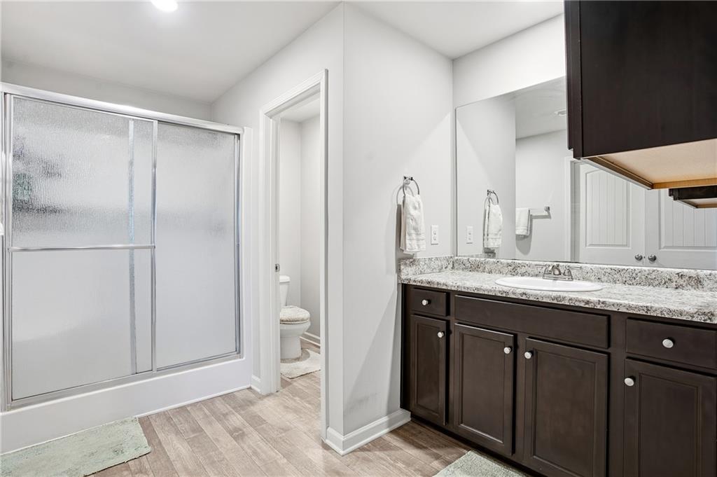 6968 New Dale Road Rex, GA 30273 - Photo 36 of 47 a bathroom with a granite countertop sink and a mirror