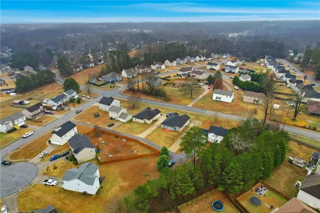 an aerial view of a house with a ocean view