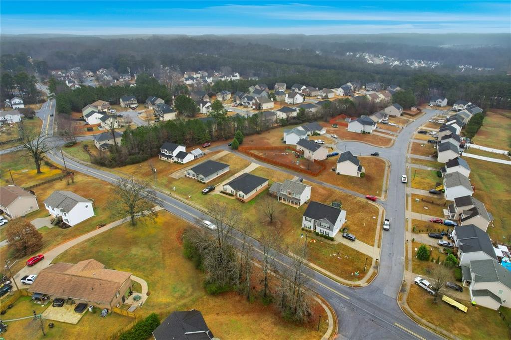 6968 New Dale Road Rex, GA 30273 - Photo 45 of 47 an aerial view of residential houses with outdoor space