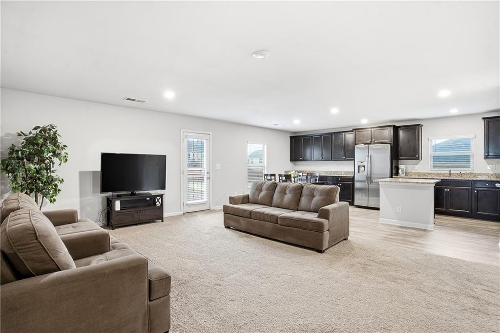6968 New Dale Road Rex, GA 30273 - Photo 7 of 47 a living room with furniture and a flat screen tv