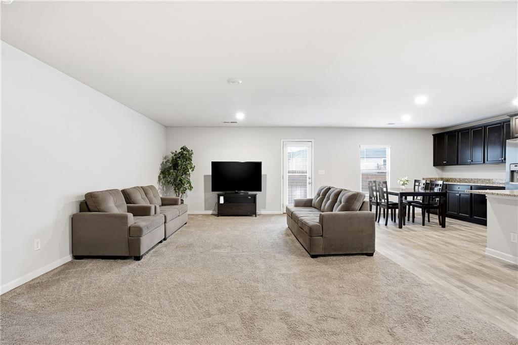 6968 New Dale Road Rex, GA 30273 - Photo 9 of 47 a living room with furniture and a flat screen tv
