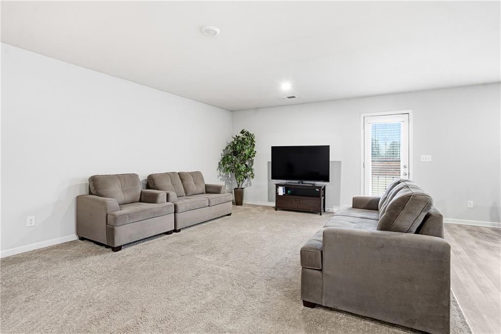 6968 New Dale Road Rex, GA 30273 - Photo 10 of 47 a living room with furniture and a flat screen tv