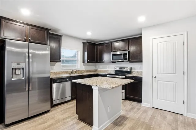 a kitchen with cabinets and sink