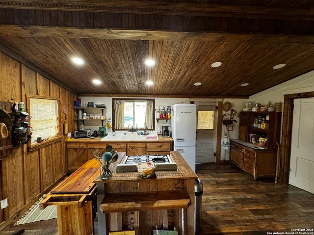 a room with lots of furniture and appliances