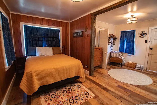 a room with furniture a chandelier and a window