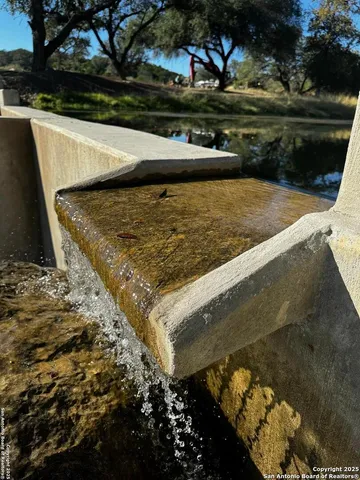 a view of swimming pool from a yard