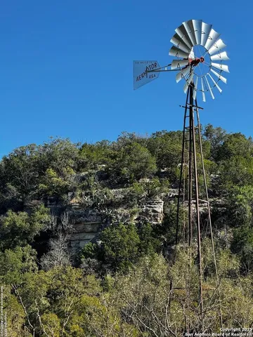 a bedroom with a bed furniture and kitchen view