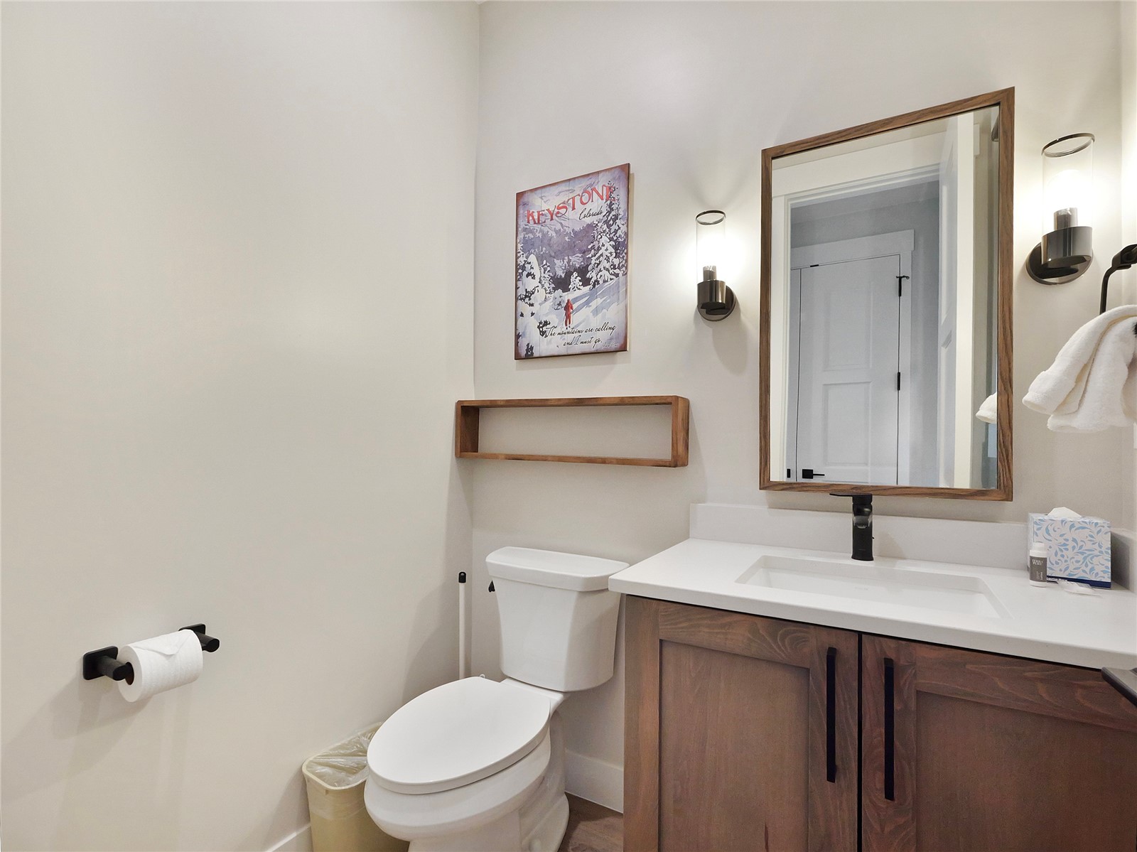 75 Alcove Court, Unit 75 Keystone, CO 80435 - Photo 14 of 40 a bathroom with a toilet sink and mirror