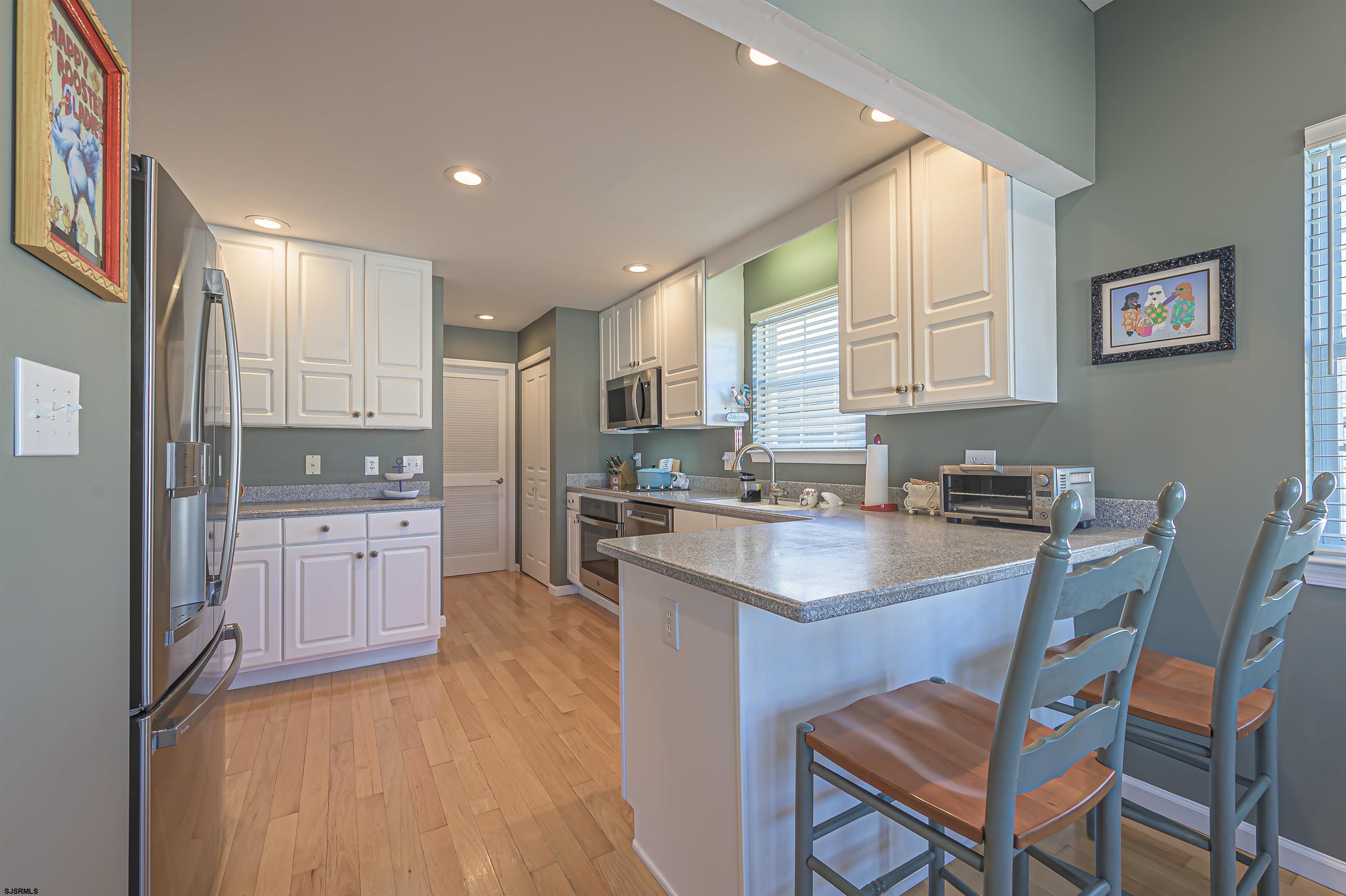 201 25th Street South Brigantine, NJ 08203 - Photo 17 of 44 a kitchen with refrigerator cabinets and a sink