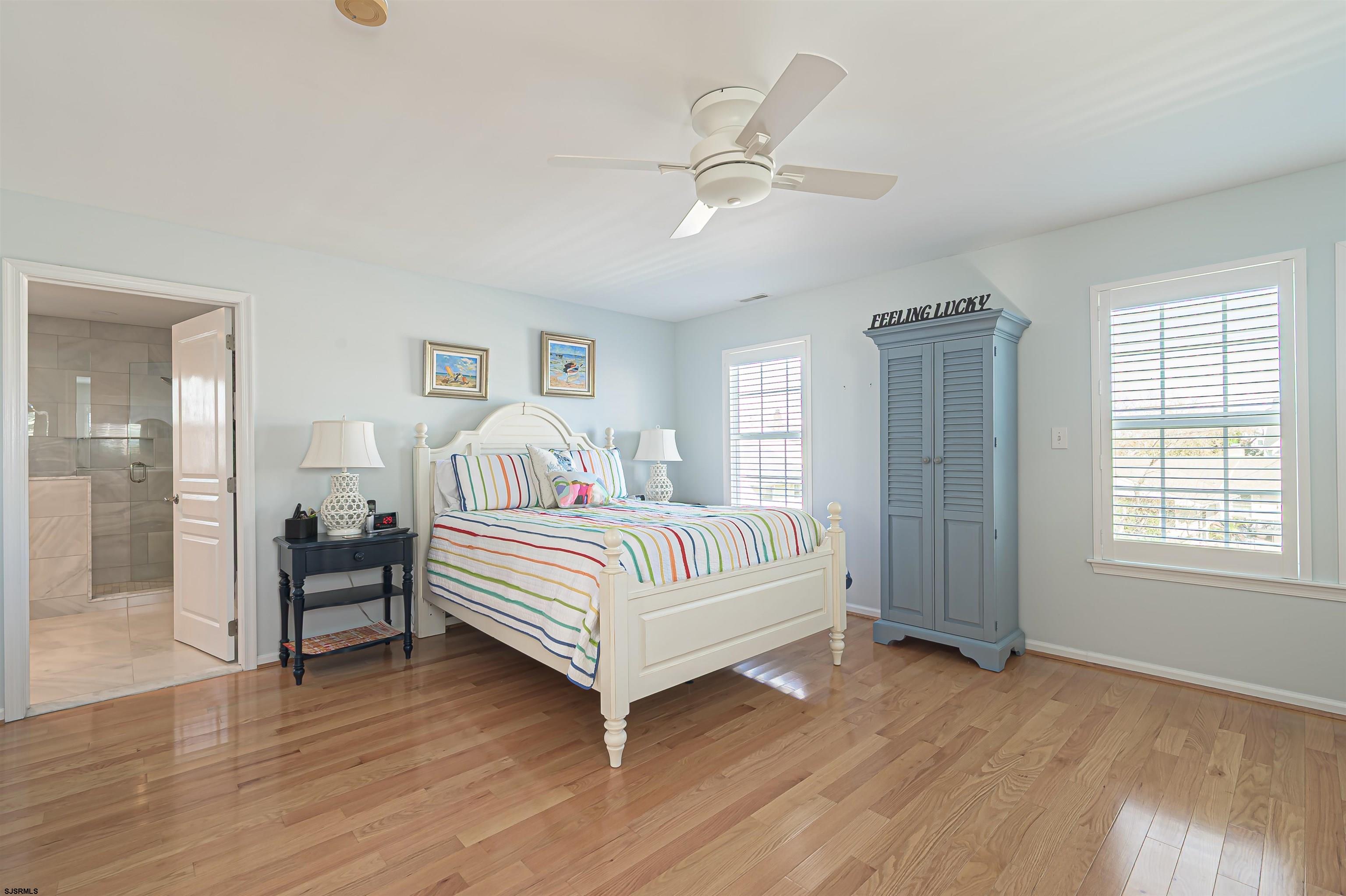 201 25th Street South Brigantine, NJ 08203 - Photo 23 of 44 a bedroom with a bed and window