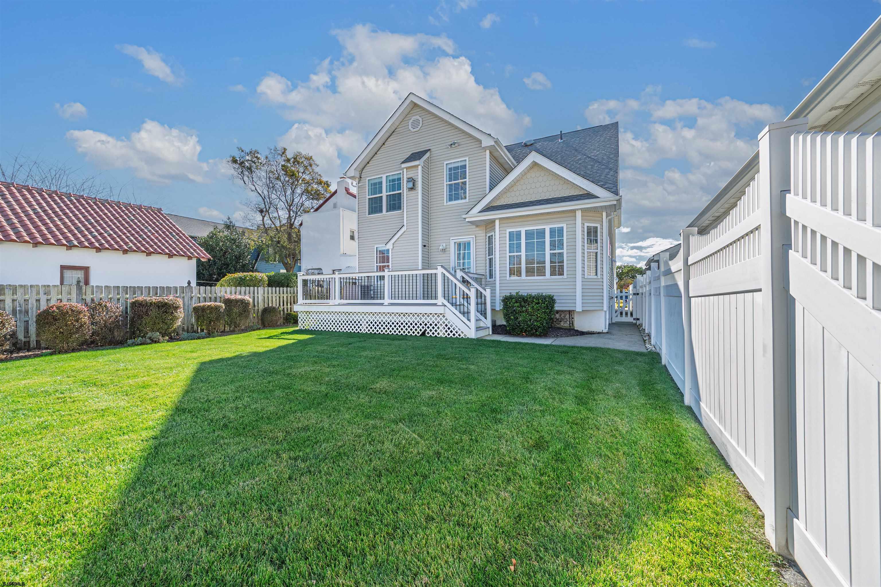201 25th Street South Brigantine, NJ 08203 - Photo 35 of 44 a view of a house with backyard and a garden