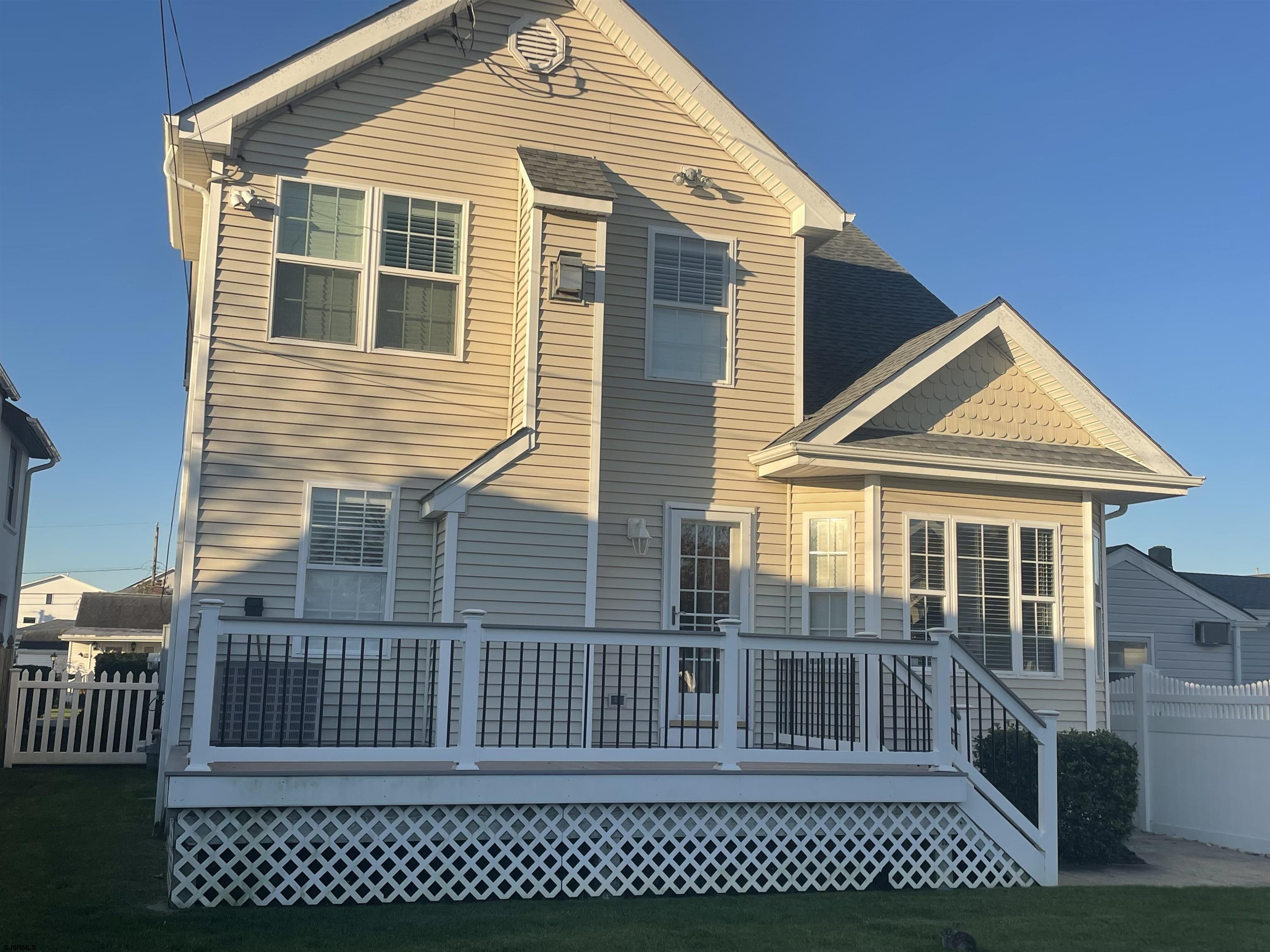 201 25th Street South Brigantine, NJ 08203 - Photo 36 of 44 a view of a house with wooden fence