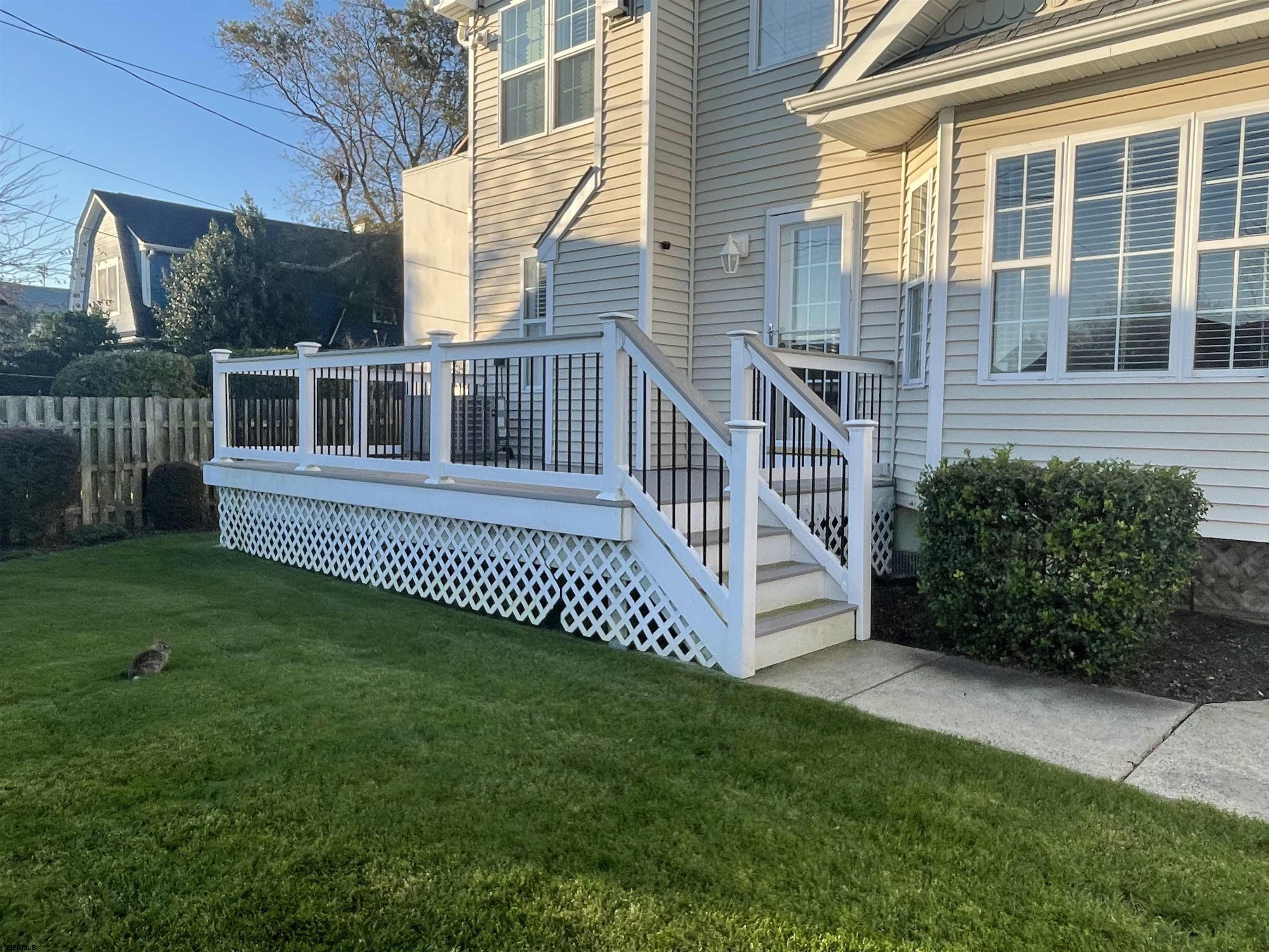 201 25th Street South Brigantine, NJ 08203 - Photo 38 of 44 a view of a house with a yard and deck
