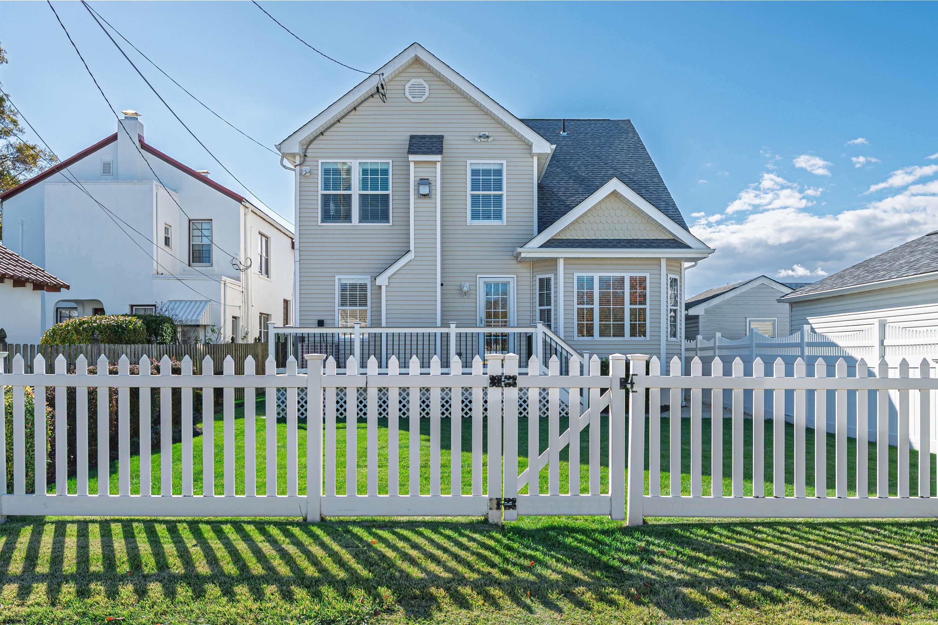201 25th Street South Brigantine, NJ 08203 - Photo 39 of 44 a front view of a house with a garden