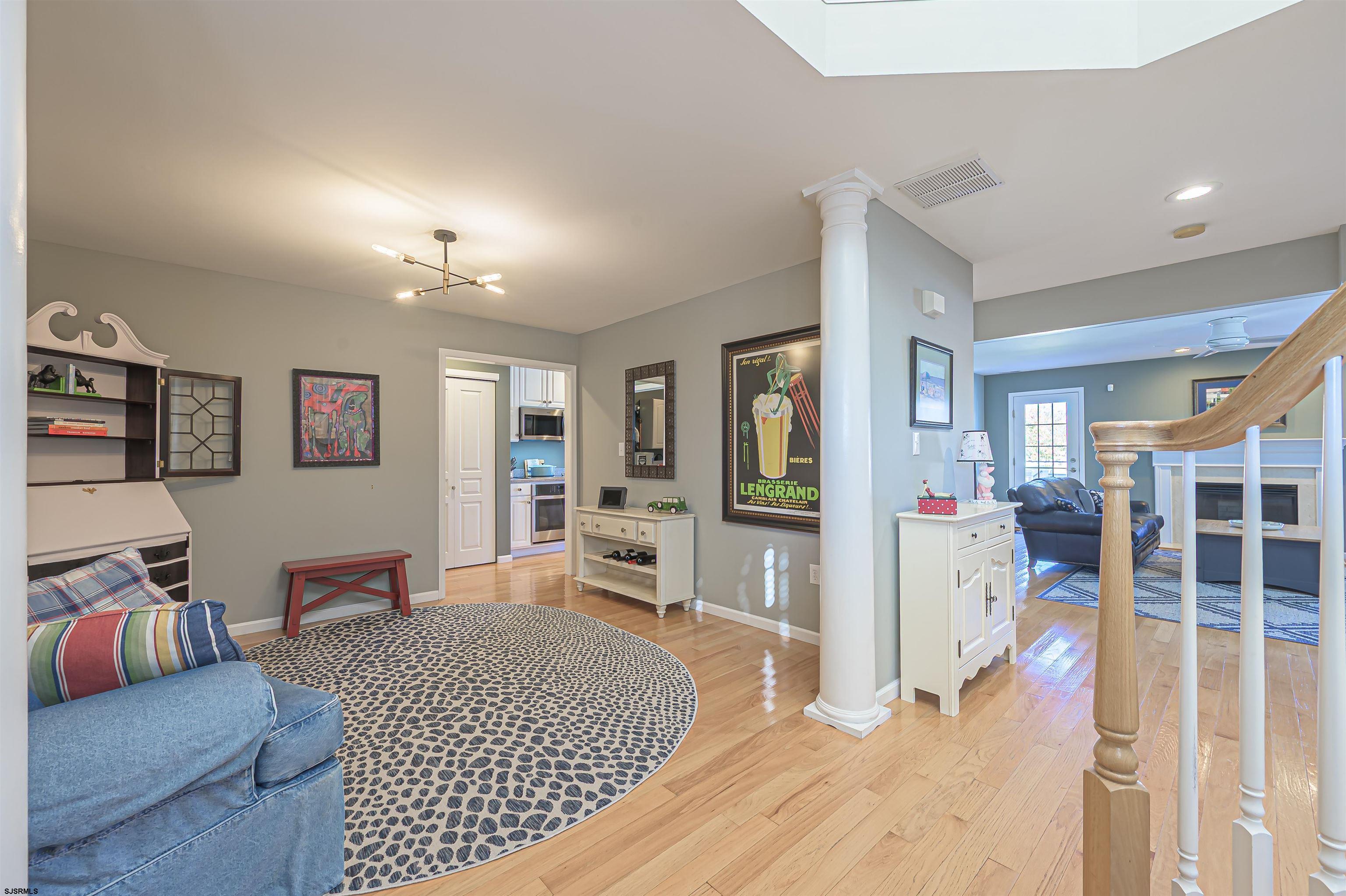 201 25th Street South Brigantine, NJ 08203 - Photo 9 of 44 a living room with furniture and a flat screen tv