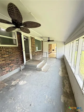 a view of swimming pool with seating space