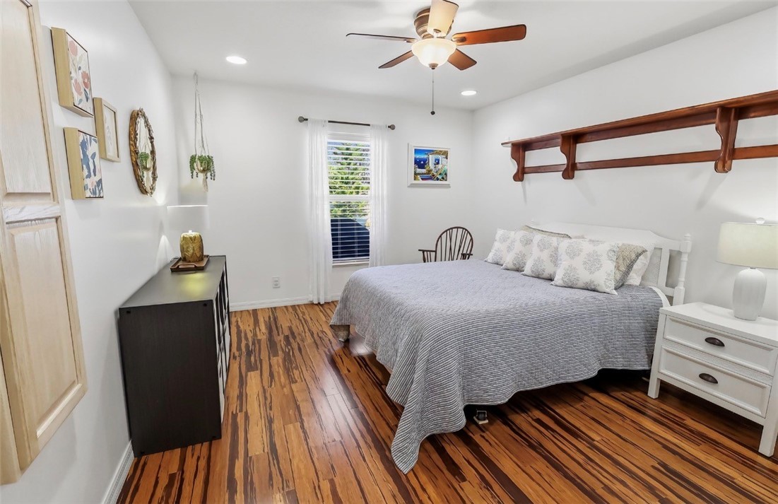 1771 Mistletoe Street Sebastian, FL 32958 - Photo 23 of 36 a bedroom with a bed and wooden floor