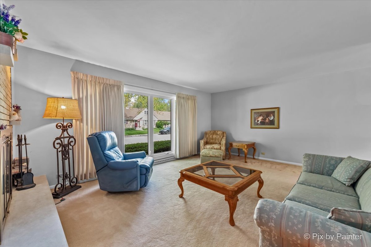 425 Summit Street Algonquin, IL 60102 - Photo 7 of 43 a living room with furniture and a floor to ceiling window