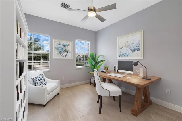 a workspace with furniture and window