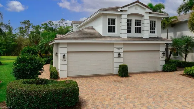 a front view of a house with parking