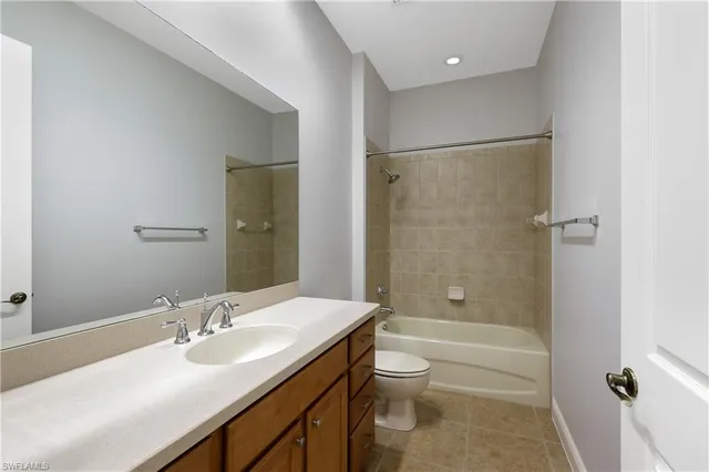 a bathroom with a sink toilet tub and shower
