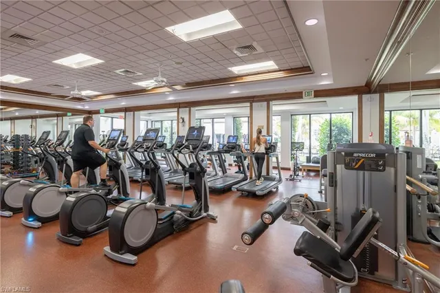a gym room with lots of gym equipment