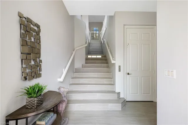 a view of an entryway with wooden floor
