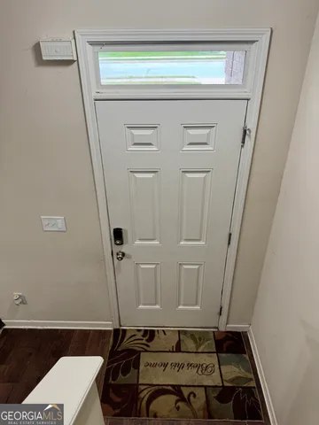 a room with water heater and a cabinet